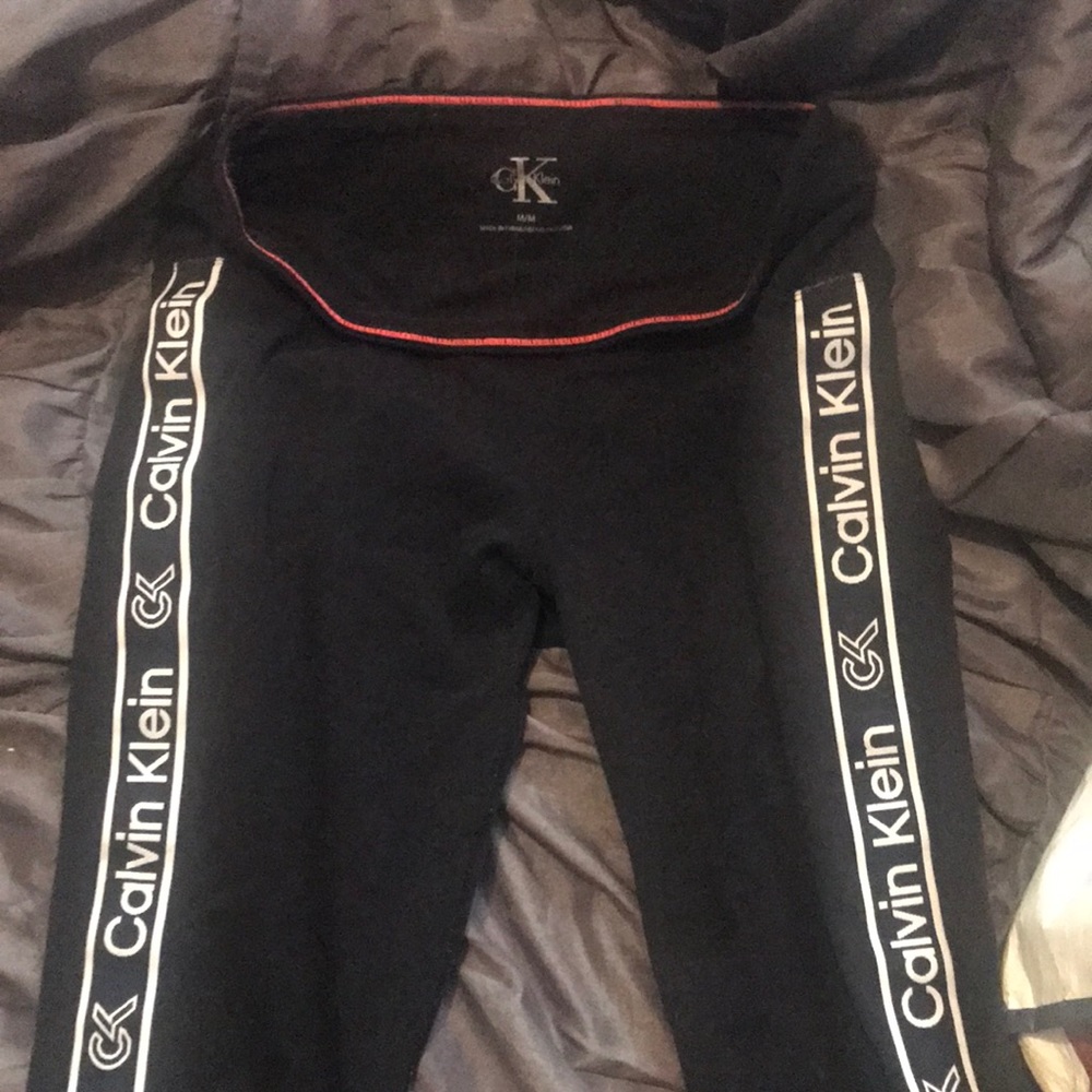 Calvin Klein full leggings black with red stitching sides say Calvin Klein